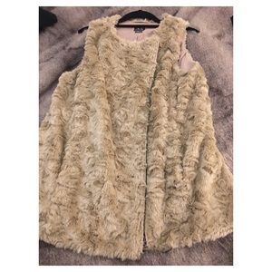 Cream colored faux fur vest